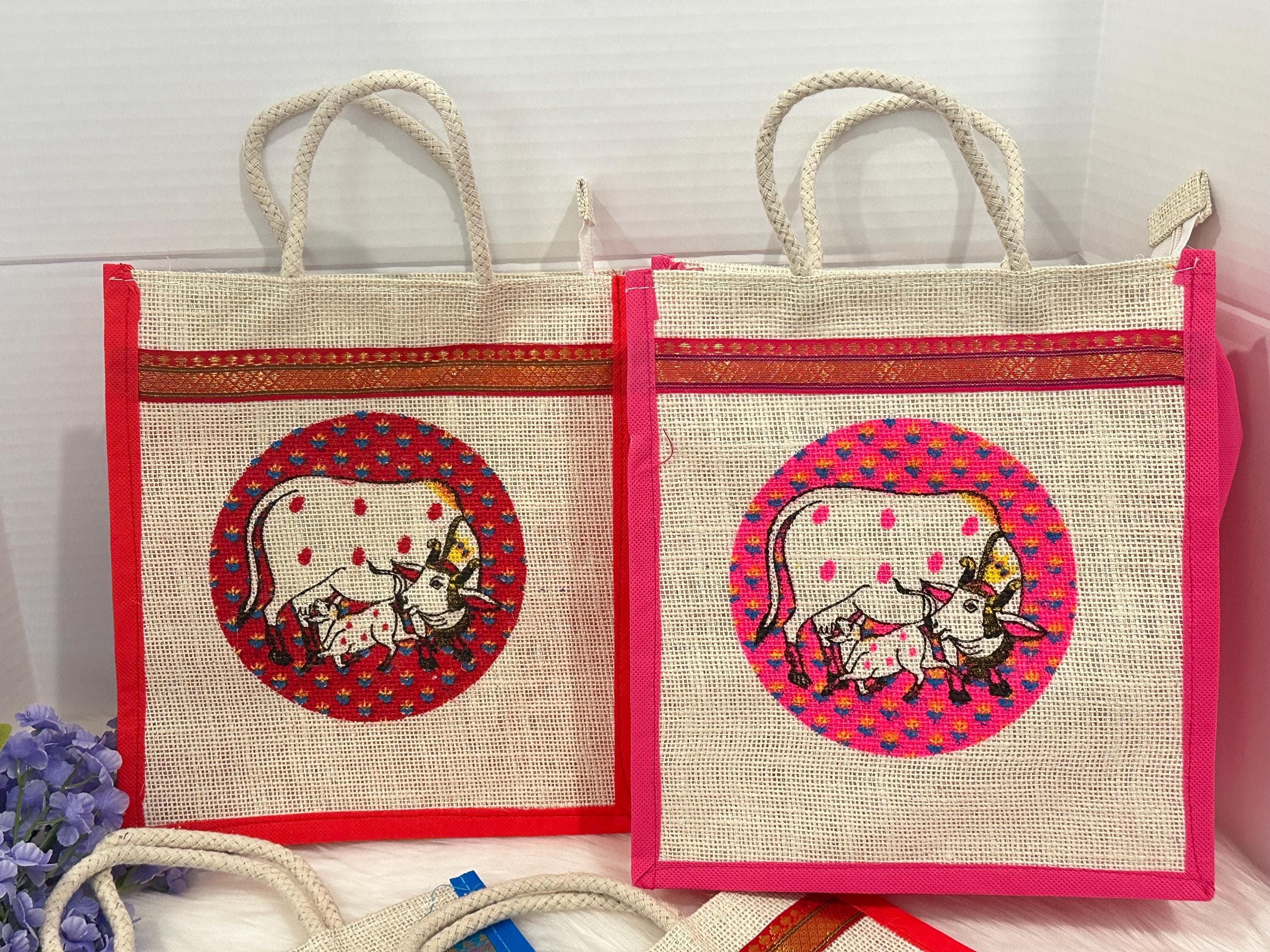 PREORDER: Pichwai Cow Design Jute Thamboolam Bag Pack Of 10 | Perfect for Weddings,Housewarming, Handbags Gift Bags