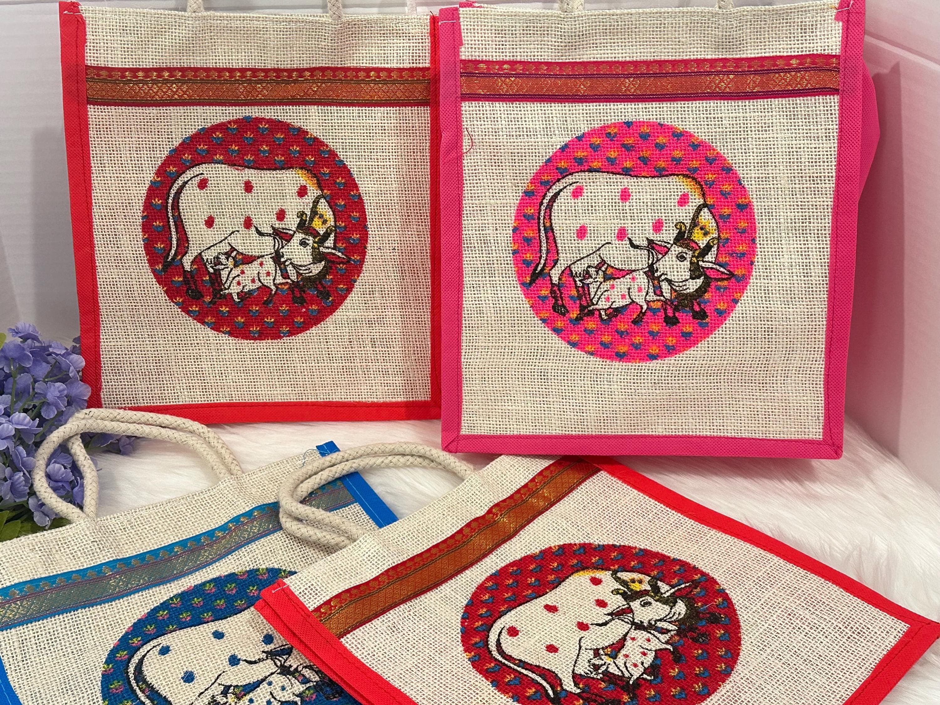 PREORDER: Pichwai Cow Design Jute Thamboolam Bag Pack Of 10 | Perfect for Weddings,Housewarming, Handbags Gift Bags — view 3